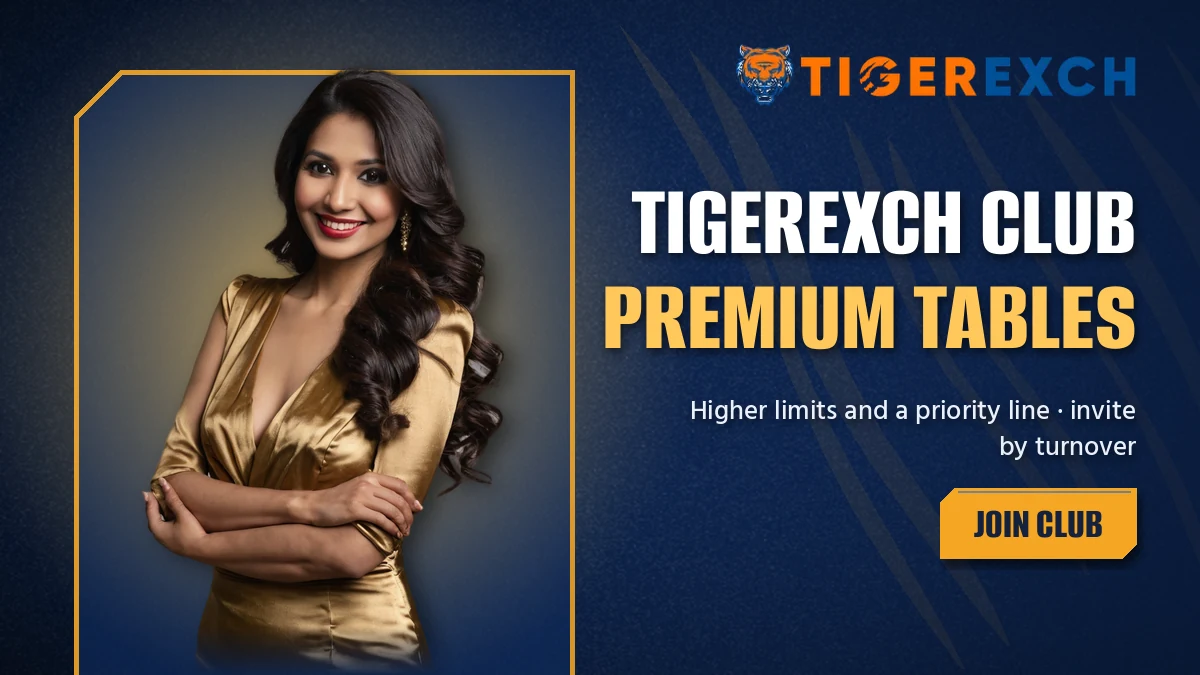 Tigerexch Club host with arms folded beside the premium tables banner